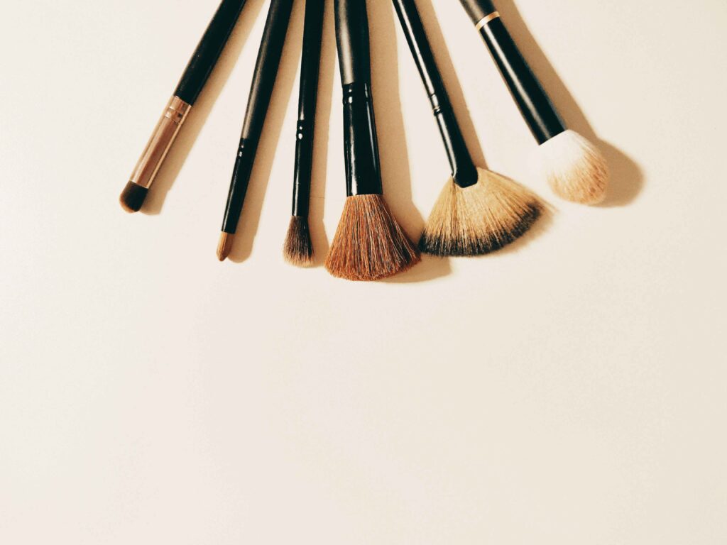 Flat lay of cruelty-free makeup brushes with synthetic bristles and bamboo handles