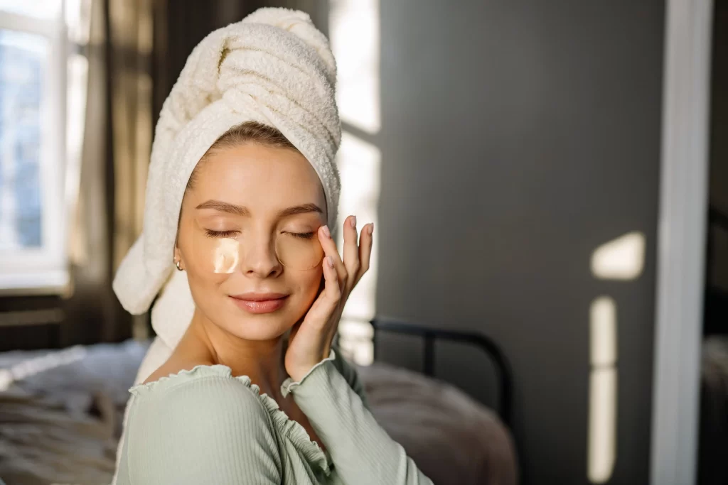 Woman with naturally glowing skin following a morning skincare routine at home 
