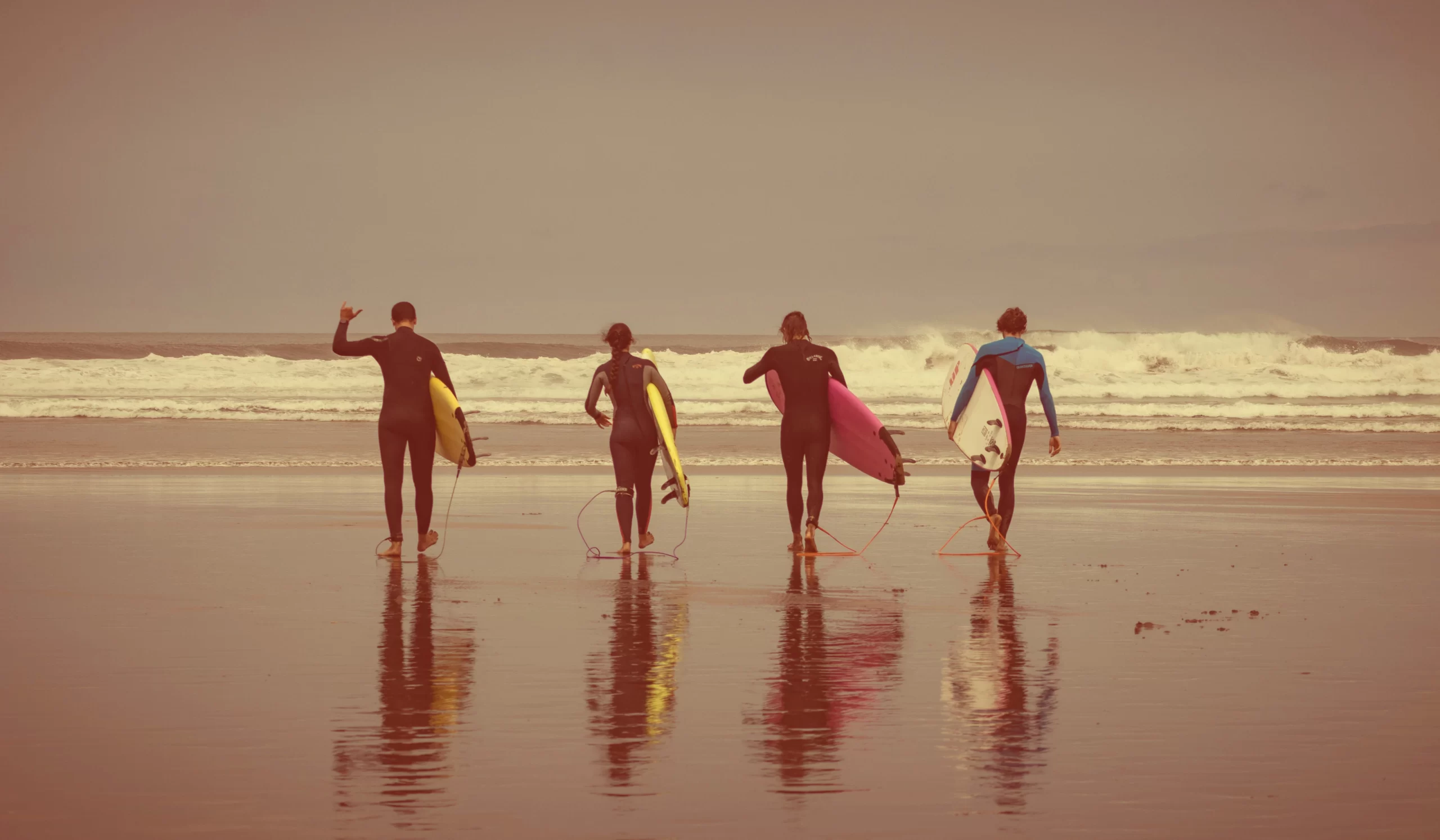 70s surf culture beach scene with men and women in retro coastal fashion