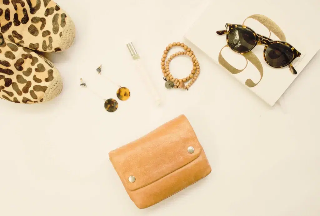 70s Surf Fashion: The Ultimate Retro Coastal Style Guide for Men and Women 3 70s surf fashion women's accessories including round sunglasses, shell jewellery and leather sandals