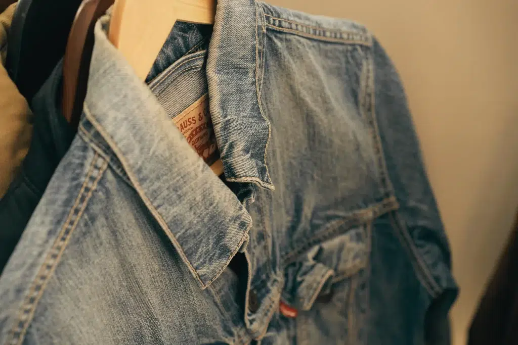 Blue B Collection clothing pieces including rhinestone jacket and fringe denim shorts 