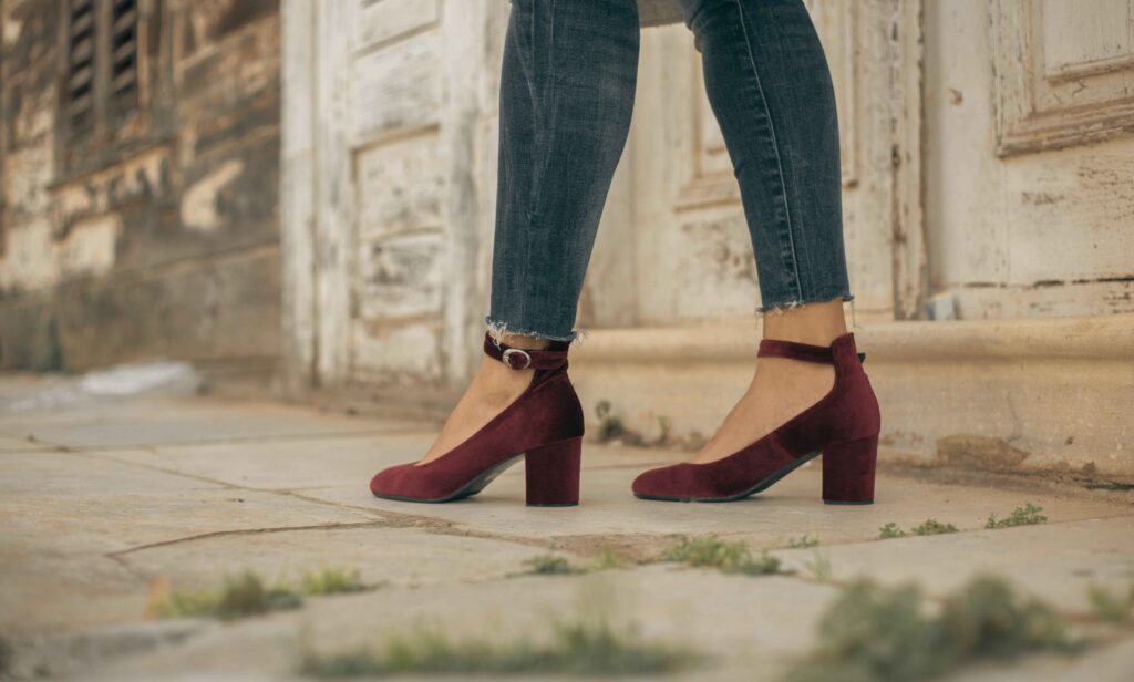 Woman wearing Hotter Donna heels walking outdoors at event
