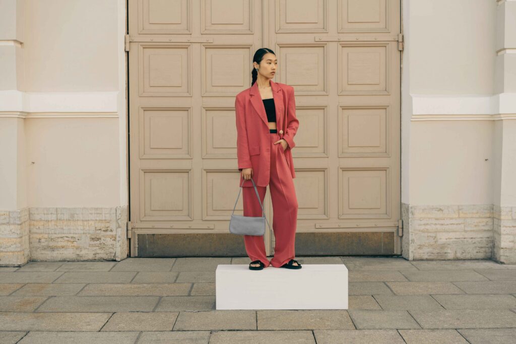 Y2K velour tracksuit dressed up with heels and structured bag