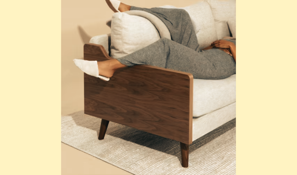 Woman relaxing at home in supportive house shoes with arch support