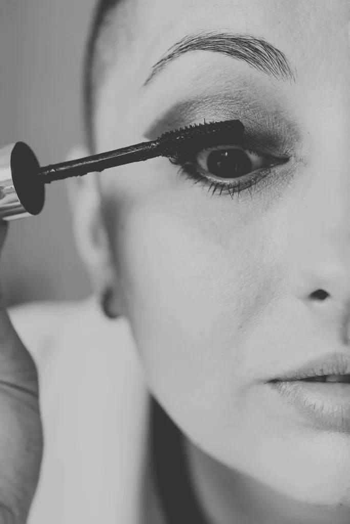 applying a cruelty free lash serum with a precision wand applicator