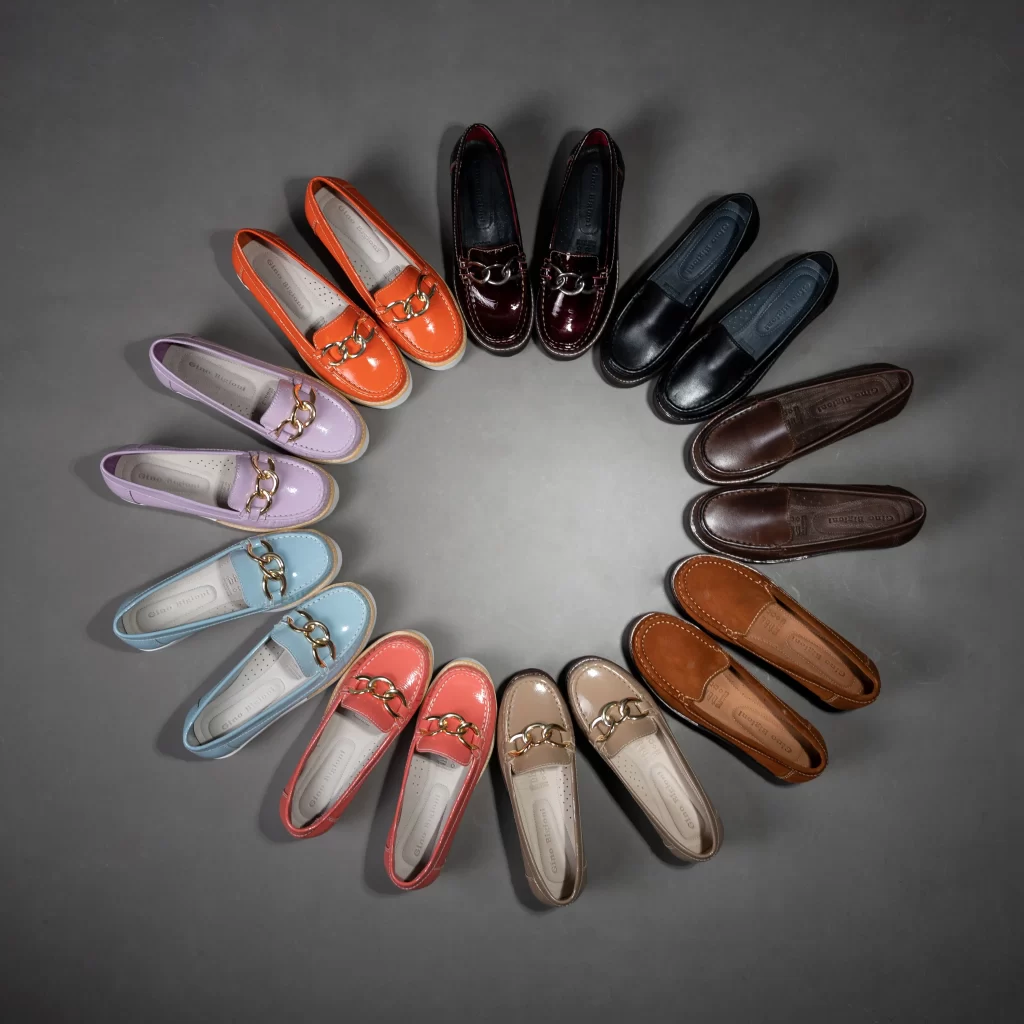 Best Ballet Flats for Women: 10 Comfortable Picks 1 Several pairs of ballet flats for women in different materials and colors arranged in a flat lay