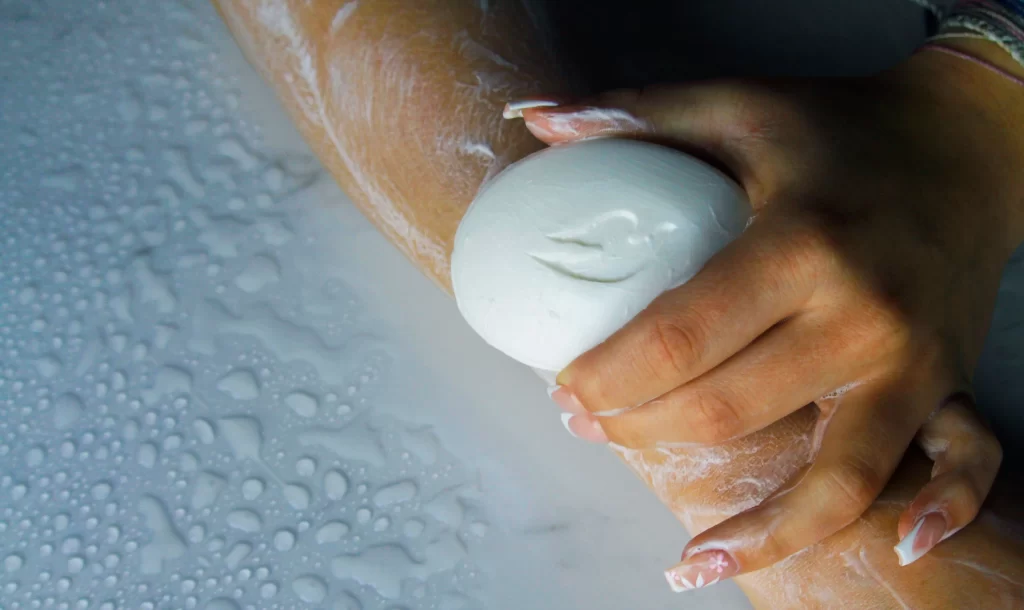 Is Dove Cruelty Free? PETA Says Yes, I Kept Digging 1 person checking the ingredient label on a Dove bottle to verify cruelty free status