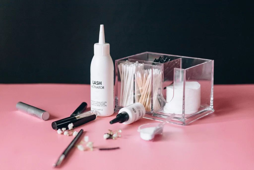 flatlay of several cruelty free lash serum bottles compared side by side