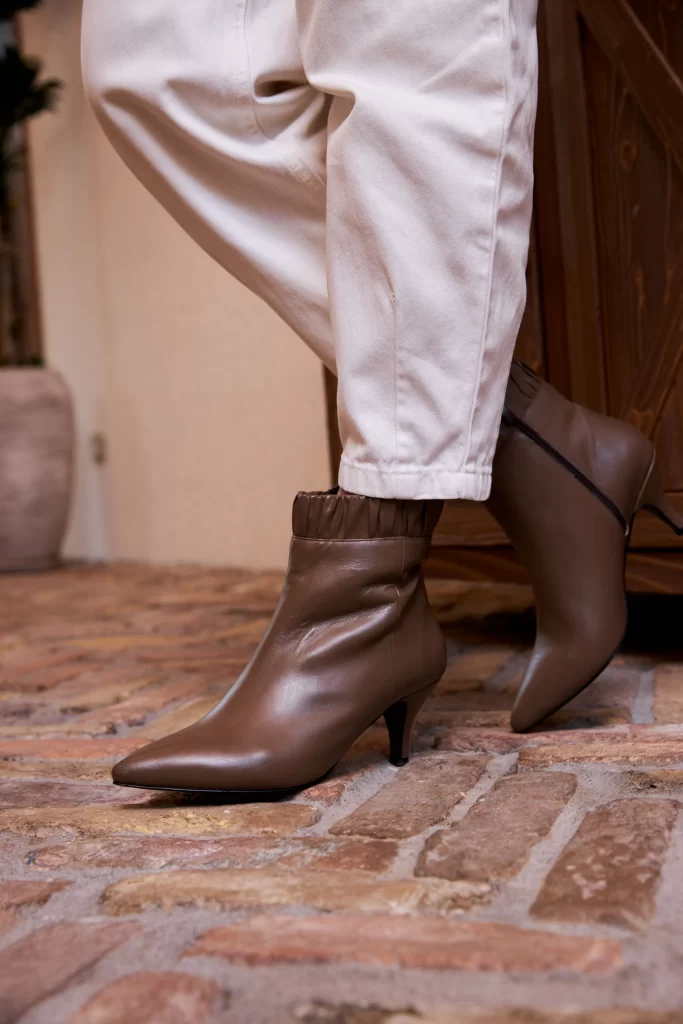 Office Boots for Women: 10 Pairs That Mean Business 2 Nude ankle boots worn with cropped trousers as an office outfit
