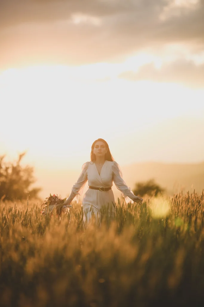 Boutiques Like Altar'd State: 7 Similar Style Picks 4 Woman in a boho tiered bell sleeve maxi dress, a romantic style found at boutiques like Altar'd State