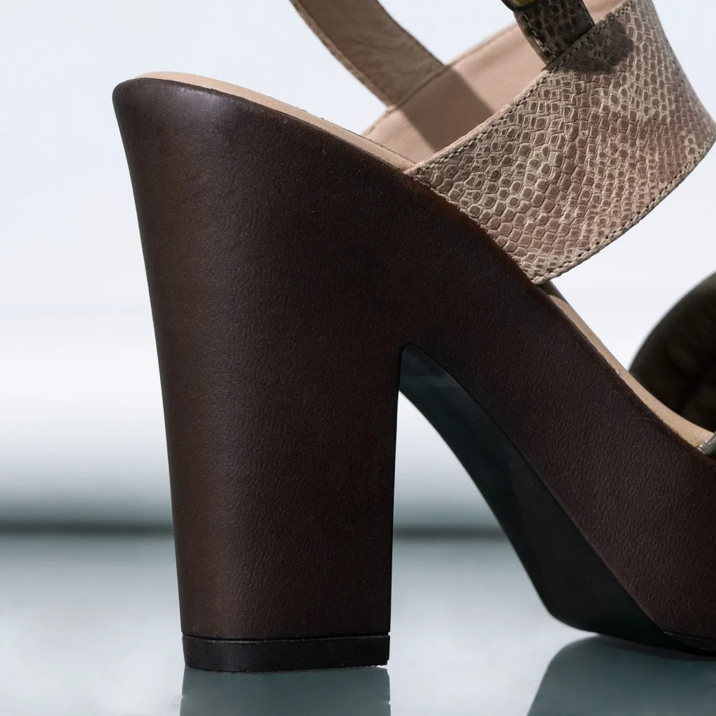 Close up of a contoured cork footbed showing built in arch support on sandals similar to Birkenstock