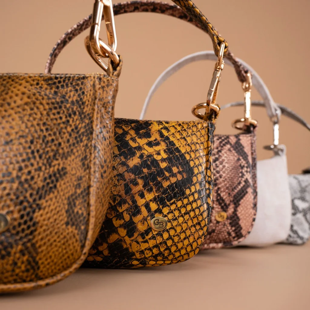designer bags of different price tiers lined up to compare whether they hold their value