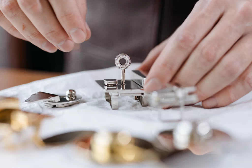 Close up of designer bag hardware used to spot a fake luxury handbag