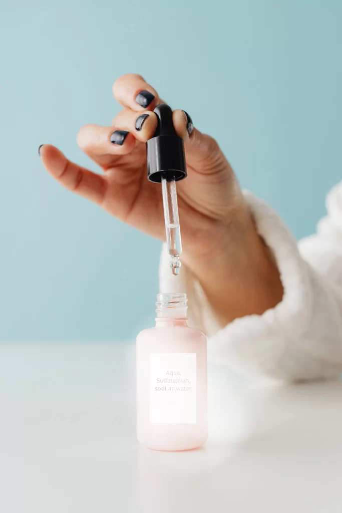 Close up of a PDRN serum bottle highlighting the salmon derived ingredient question
