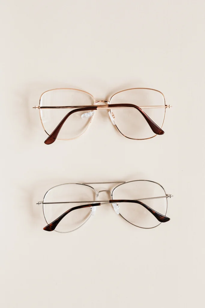 Close up of an oversized aviator lookalike with adjustable nose pads beside a second aviator pair