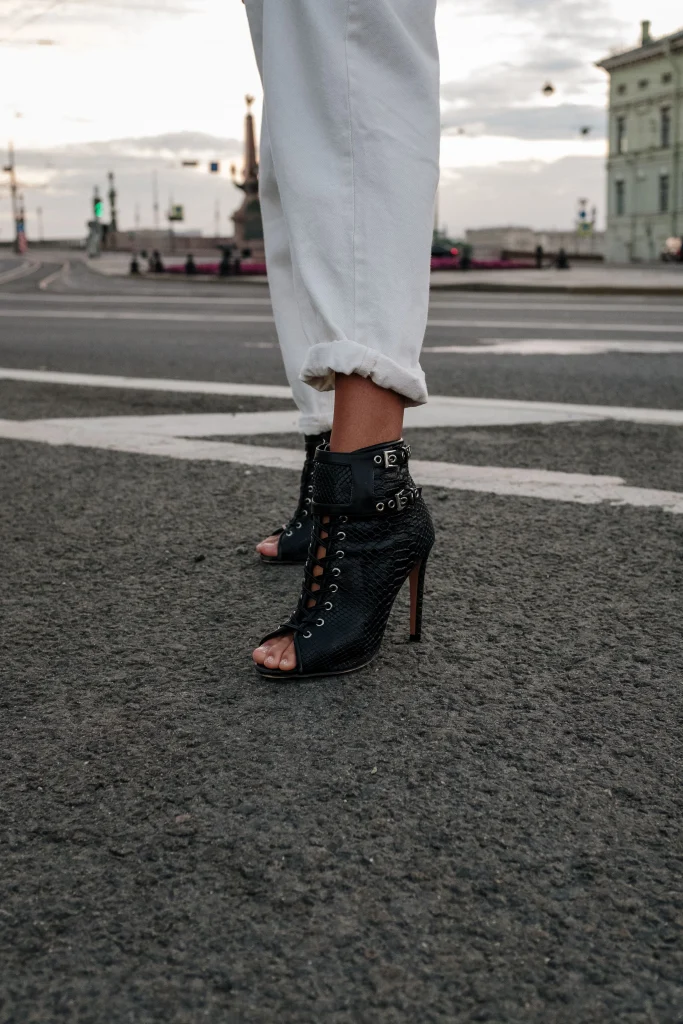 8 Best Shoe Brands Like Steve Madden to Shop 3 Trendy ankle boots similar to Steve Madden being worn outdoors on a city sidewalk