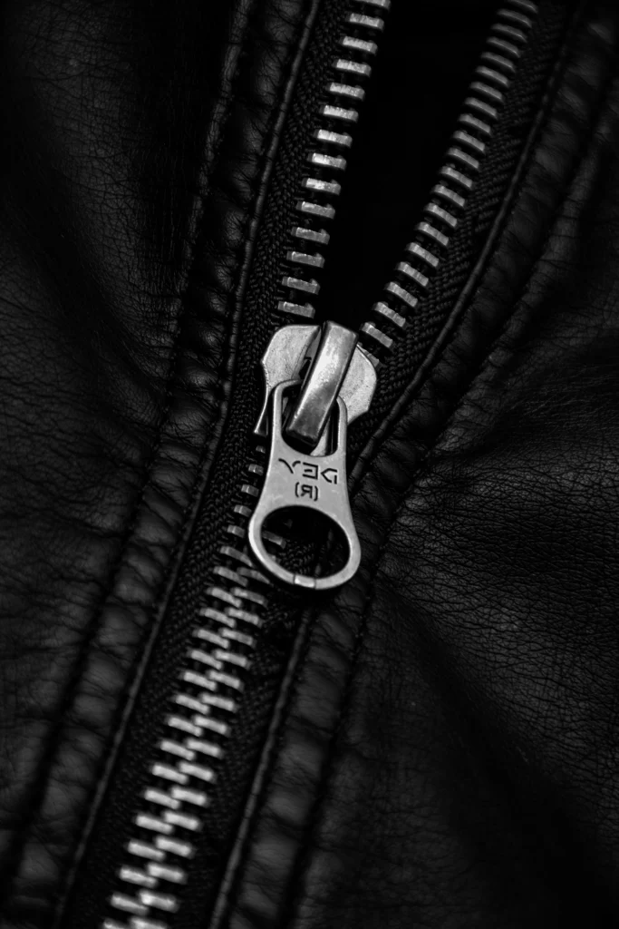 Fashionphile vs The RealReal: Which Pays You More? 4 Close up of handbag hardware and stitching during an authentication check before resale