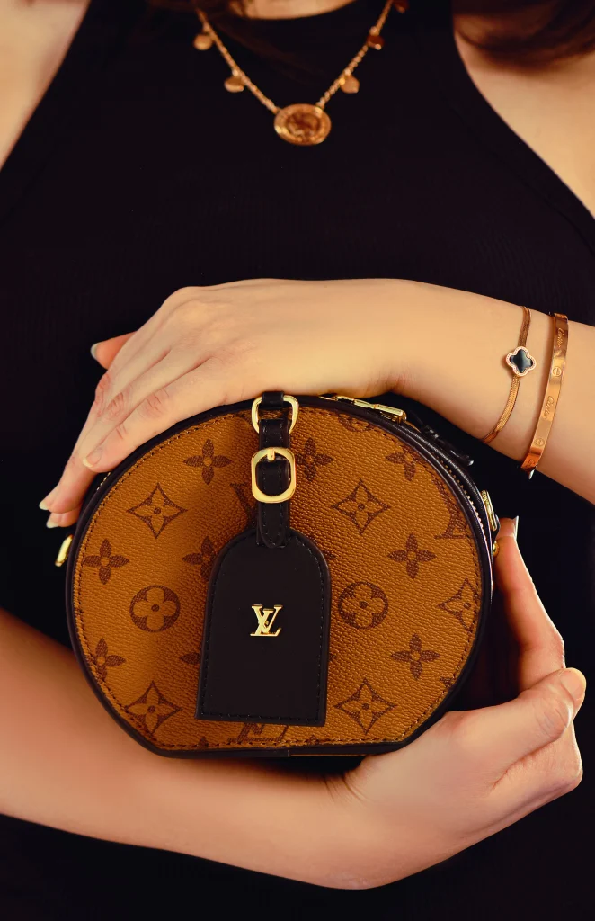 Goyard vs Louis Vuitton: Which One Is Worth the Money? 2 Close up of Goyardine chevron canvas and Louis Vuitton Monogram canvas compared for quality