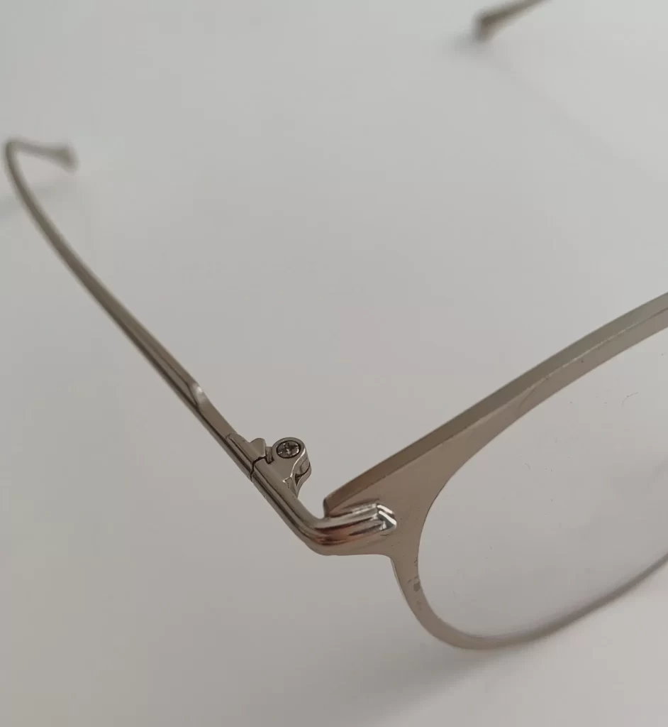 7 Affordable Sunglasses That Look Like Ray-Bans 6 Close up of a sunglasses hinge and nose pad during a real versus fake Ray Ban check