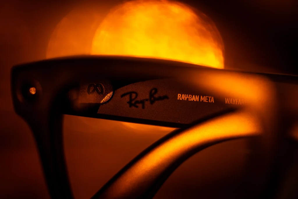 Quay vs Ray-Ban: Which Sunglasses Are Worth the Money? 4 Close up of the P mark beside the logo on a polarized Ray Ban lens, one way to check if Ray Bans are real